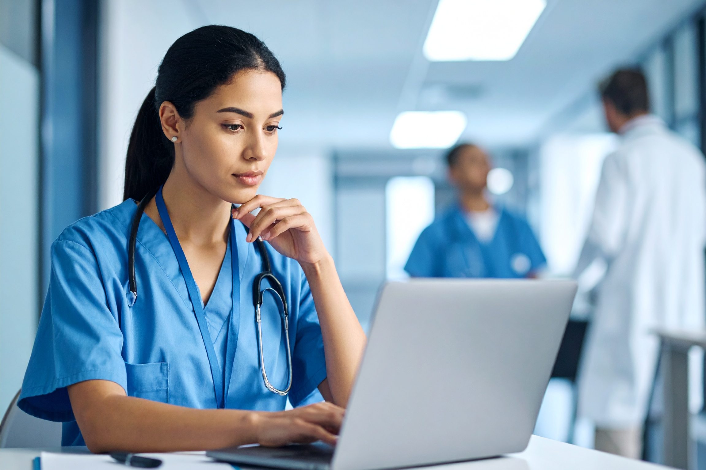 cropped-Firefly_Young-nurse-writes-on-laptop-with-thoughtful-expression-in-hospital-687254.jpg